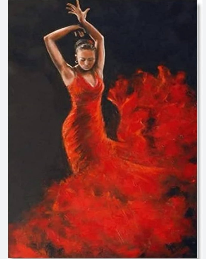 Flamenca con vestido rojo llameante sobre fondo negro