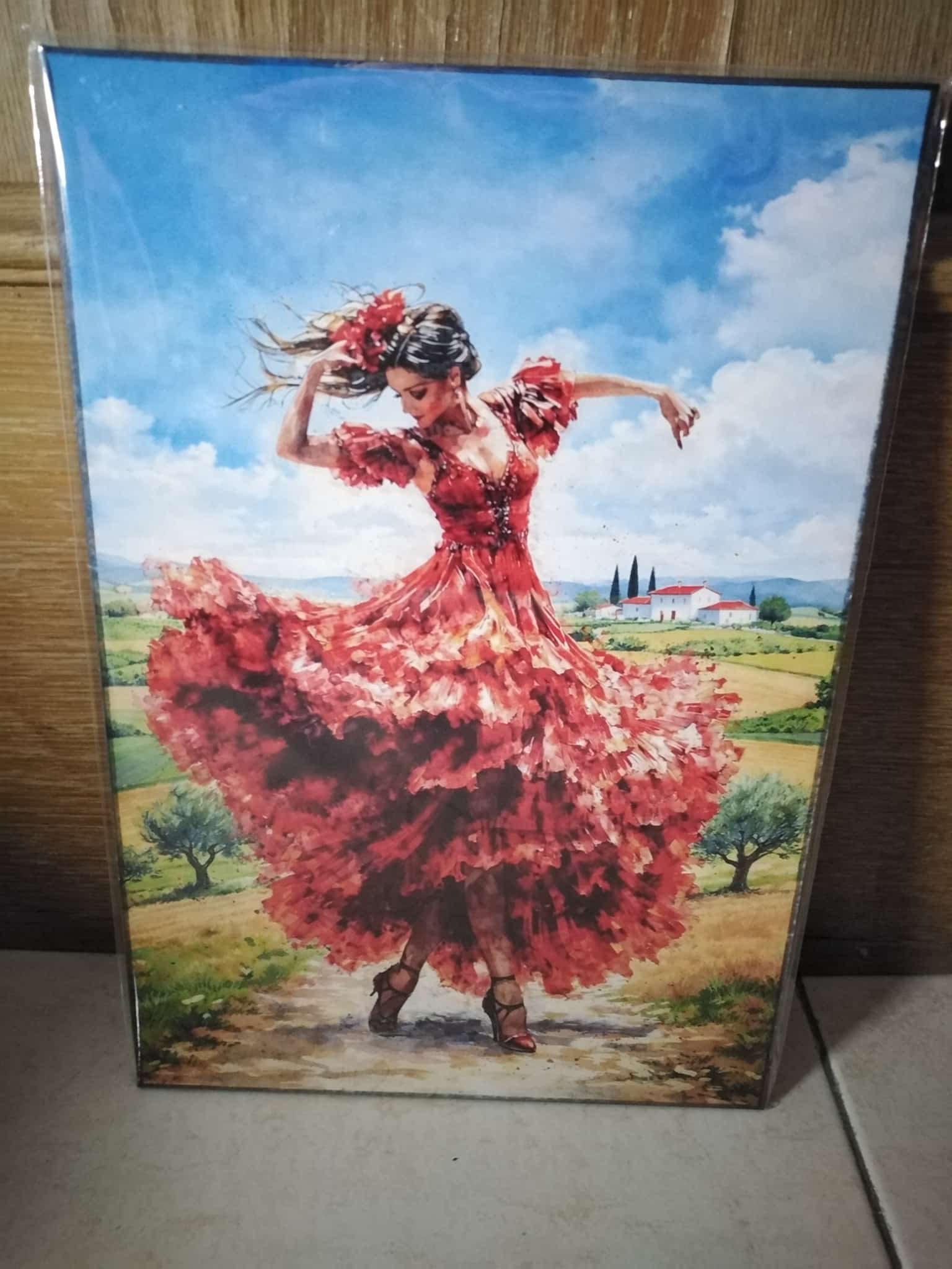 Cuadro de madera flamenca con vestido rojo bailando en paisaje andaluz