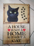 Cuadro de madera gato negro ojos verdes con huellas y frase A House Is Not a Home Without a Cat
