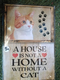 Cuadro de madera gato naranja y blanco con huellas negras y frase A House Is Not a Home Without a Cat con corazones rojos